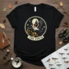 The Finch T-Shirt design with a flying finch bird in a circular motif, moon, stars, and branches
