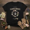 The Flower Grower t-shirt with a floral wreath, watering can, and gardening tools design