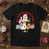 The Gang of Christmas text with a group of cartoon cats wearing Santa hats and scarves on a black t-shirt