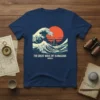 The Great Wave Off Kanagawa t-shirt design featuring Hokusai's famous woodblock print with a sailing boat and a large wave