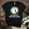 Wedding couple dancing with text "The Greatest Adventure Begins" on a black t-shirt, featuring vibrant circular graphics