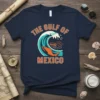 The Gulf of Mexico t-shirt design with a large ocean wave, a treasure chest, and schools of fish
