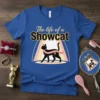 The life of a Showcat text with a black cat wearing a crown and pink sash on a blue t-shirt