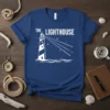 The Lighthouse graphic t-shirt design featuring a white lighthouse with beams of light and stars on a navy blue shirt