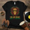Black t-shirt with "The Lion Roars Roots & Culture" text and a stylized lion wearing sunglasses, featuring Rasta colors