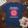 The Magic In The Details Dahlia Bloom t-shirt with a vibrant pink and orange dahlia flower graphic and white text