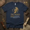 Navy t-shirt with golden Spartan helmet graphic and "The Medes Very Bad Would Not Recommend — Aššur-Uballit II" text, featuring