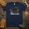 The Moose Is Loose t-shirt design featuring a cartoon moose breaking through a fence, with text in bold white font
