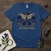 The Night Flora t-shirt design with a large moth and dark blue roses, featuring gothic-inspired text