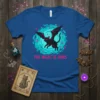 The Night Is Ours t-shirt design featuring a black cat with bat wings against a celestial blue background with pink