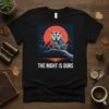 The Night Is Ours text on a black t-shirt featuring a detailed owl perched on a branch under a large