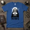 The Nun II t-shirt design featuring a skeleton nun holding a cross, with a gothic church and moon in the