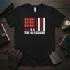 The Old Guard t-shirt design with a stylized American flag featuring swords and stripes