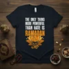 T-shirt featuring the quote "The Only Thing More Powerful Than Hate Is Ramadan" in bold white and orange text, with