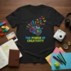 The Power of Creativity t-shirt design with a colorful brain graphic and butterflies, inspiring artistic expression