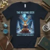 The Reading Deer Magic Of The Northern Nights t-shirt featuring a deer reading a book in a snowy forest under