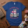 The Reading Lounge Where Stories Pop T-Shirt with a wolf blowing bubblegum, sitting on books