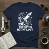 The Sky Is Not My Limit quote on a navy t-shirt with a white rocket, astronaut, and starry space background