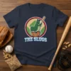 The Slugs baseball team t-shirt design with a cartoon slug batting on a baseball, set against a baseball field background