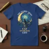 The Starry Night Cat Overlook City t-shirt design featuring a black cat on a cityscape under a starry night sky