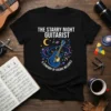 The Starry Night Guitarist T-Shirt with "A Symphony Of Cosmic Melodies" text and a blue guitar in a starry galaxy