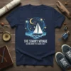 The Starry Voyage Sailing Under The Cosmic Light t-shirt featuring a sailboat under a starry night sky