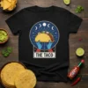 The Taco tarot card design featuring a taco held by blue hands under moon phases, on a black t-shirt