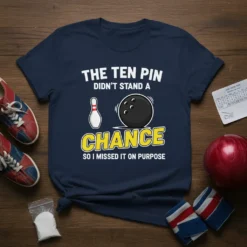 Navy blue t-shirt with white text reading "THE TEN PIN DIDN'T STAND A CHANCE SO I MISSED IT ON PURPOSE"