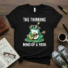 The Thinking Mind Of A Frog quote with a cartoon frog playing guitar and wearing sunglasses, on a black t-shirt