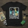 The Trash Is Out There t-shirt design with a raccoon astronaut and a UFO beaming up a trash can