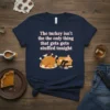 Funny Thanksgiving t-shirt with the quote "The turkey isn't the the only thing that gets gets stuffed tonight" featuring a