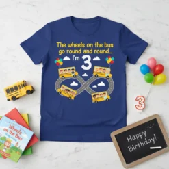 The wheels on the bus birthday t-shirt for a 3-year-old, featuring yellow school buses and the text "I'm 3"