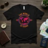 The World Is Yours text with a vibrant map graphic on a black t-shirt, symbolizing travel and adventure