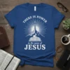 Christian T-Shirt with "There Is Power In The Name Of Jesus" text, cross on a mountain, and open Bible graphic