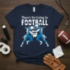 There's No Crying In FOOTBALL t-shirt design featuring two football players clashing and text in white and blue