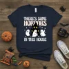 There's Some Horrors In This House Halloween T-Shirt with ghosts and haunted house graphic