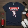 Navy t-shirt with "THICC GIRLS DO IT BETTER" in red and white text, featuring graphics of muscular arms and a