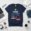 Navy t-shirt with "THINK CODE DEBUG REPEAT" design and a ladybug graphic, symbolizing the programming cycle