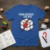 Blue t-shirt with "THINK OUTSIDE THE BOX" text and a stylized cube graphic with a red lightning bolt