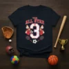 Dark blue t-shirt with "THIS ALL STAR IS 3" in red and white, surrounded by various sports balls and equipment