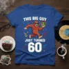 THIS BIG GUY JUST TURNED 60 birthday t-shirt featuring a cartoon Bigfoot holding a gift and wearing sunglasses