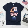 This Bitch Votes t-shirt design featuring a flexed bicep holding a ballot and a ballot box