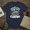 This Boy Loves Camping t-shirt with a retro camper, mountains, campfire, and river graphic