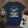 This Boy Loves Camping t-shirt design with a cozy campfire scene and a sleeping fox graphic