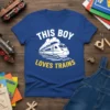 Blue t-shirt with white text "THIS BOY LOVES TRAINS" and a graphic of a white train on tracks