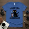 Blue t-shirt with the text "THIS CAT LADY HOLDS GRUDGES" and a grumpy black cat with an hourglass