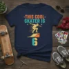 Navy blue t-shirt with "THIS COOL SKATER IS 6" text and a graphic of a skater doing a trick on