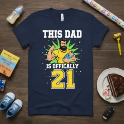 This Dad Is Officially 21 T-Shirt with a muscular dad holding a baby graphic and bold text