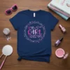This Girl Glows inspirational quote on a navy blue t-shirt surrounded by pink and white stars