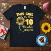 THIS GIRL Is Now 10 Double Digits text with a smiling sunflower graphic on a black t-shirt for a 10th